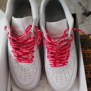 Supreme White Sneakers with Red Accents